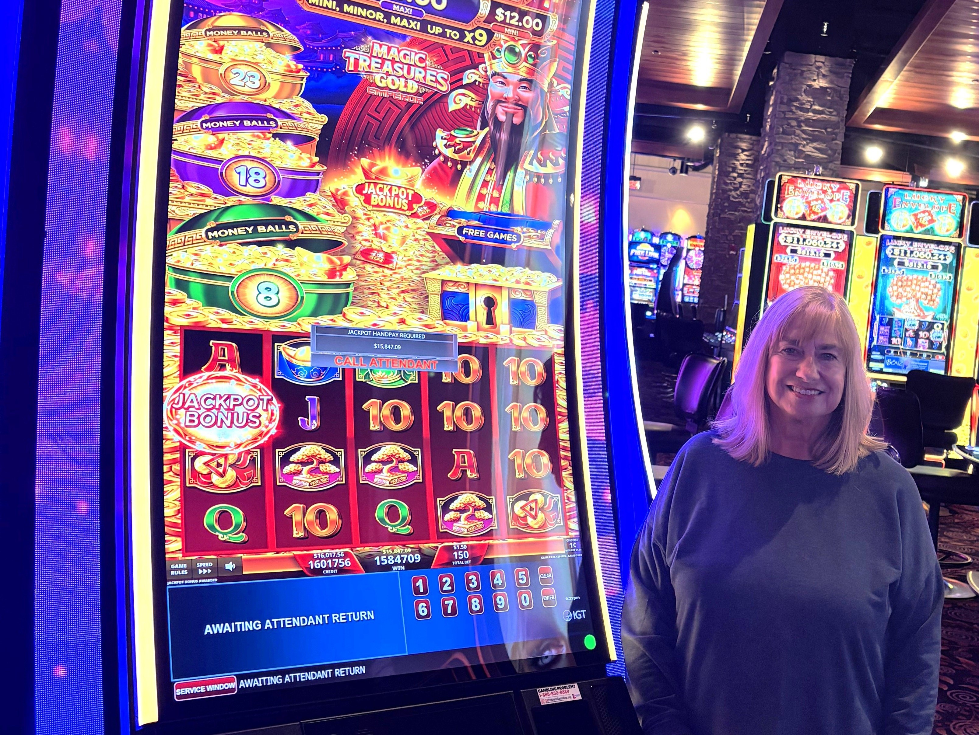 Lady next to slot machine.