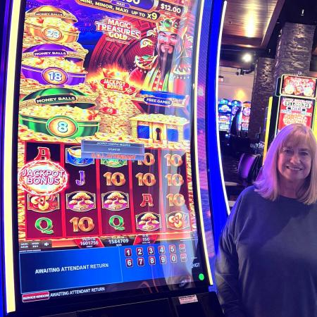 Lady next to slot machine.
